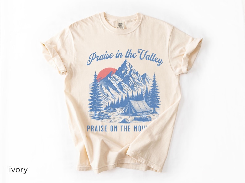 Elevation Brandon Lake Fan Shirt Praise in the Valley Praise on the Mountain Comfort Colors 1717 tee,tshirt in neutral colors trendy with praise in the valley in cursive font and praise on the mountain in a sans serif witha blue print of a mountain