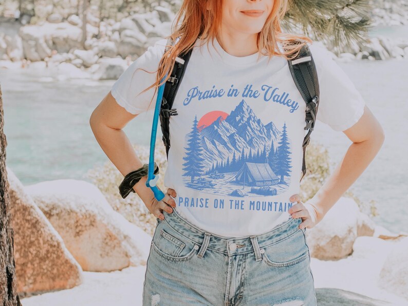 Elevation Brandon Lake Fan Shirt Praise in the Valley Praise on the Mountain Comfort Colors 1717 tee,tshirt in neutral colors trendy with praise in the valley in cursive font and praise on the mountain in a sans serif witha blue print of a mountain