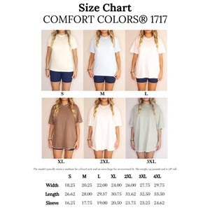 May include: Size chart for Comfort Colors 1717 t-shirts. The image shows models wearing various sizes of t-shirts in different colours. Measurements are provided in cm for width, length, and sleeve length for sizes S through 4XL.