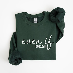 May include: A dark green sweatshirt with the text "even if" in white cursive lettering and the text "DANIEL 3:18" in smaller white lettering below.