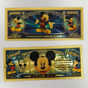 May include: Two rectangular novelty bills featuring Mickey Mouse graphics. The top bill displays the text 'ONE MILLION' and 'IF YOU CAN DREAM IT YOU CAN DO IT'. The bottom bill features a large Mickey head, 'ONE MILLION', and text about Mickey Mouse.
