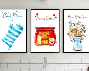 May include: Three framed watercolor prints with black borders. The left print says "Chef Mom" and features a blue oven mitt. The middle print says "Mama's Kitchen" and shows a bread box with bread and jam. The right print says "Made With Love" and shows kitchen utensils in a vase.