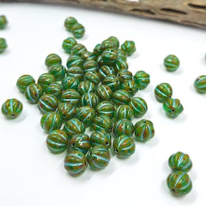 Czech Glass Beads "Melon" Aqua base with Picasso finish and a Blue Metallic Wash 8mm Pkg of 10