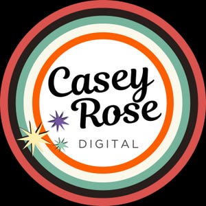 May include: A white circle with a red, orange, and green ring around it. The text "Casey Rose DIGITAL" is in the center of the circle.