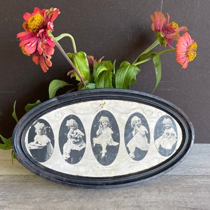 May include: A black oval tin with a white background and five images of a young girl in different poses. The text "Hearing & The Five Senses" is printed on the tin.