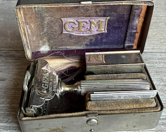 Navaja de afeitar GEM antigua en estuche con cuchillas, circa 1920.