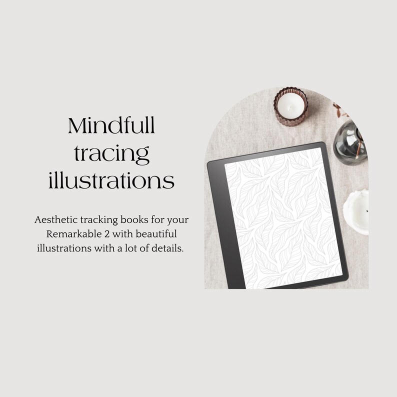 May include: A black and white illustration of leaves on a digital tablet screen. The tablet is on a beige surface with a candle and other decorative items.