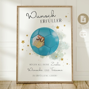 Könnte beinhalten: Gerahmter Kunstdruck mit einem türkisfarbenen Fußball und einem 50-Euro-Schein, umgeben von goldenen Sternen. Der Druck enthält den deutschen Text "Wunsch Erfüller" und eine motivierende Botschaft. Das Kunstwerk ist vor weißem Hintergrund.