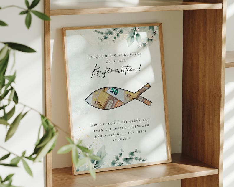 May include: A white card with a watercolor design of green leaves and a fish with a money slot. The card says "Herzlichen Gl&uuml;ckwunsch zu deiner Konfirmation!" and "Wir w&uuml;nschen dir Gl&uuml;ck und Segen auf deinem Lebensweg und alles Gute f&uuml;r deine Zukunft!"