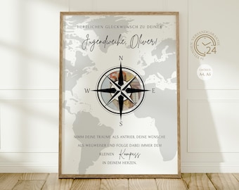 May include: A framed print featuring a world map and a compass rose design. The print includes German text, including "Herzlichen Glückwunsch zu deiner Jugendweihe, Oliver!". The frame is a light brown colour.