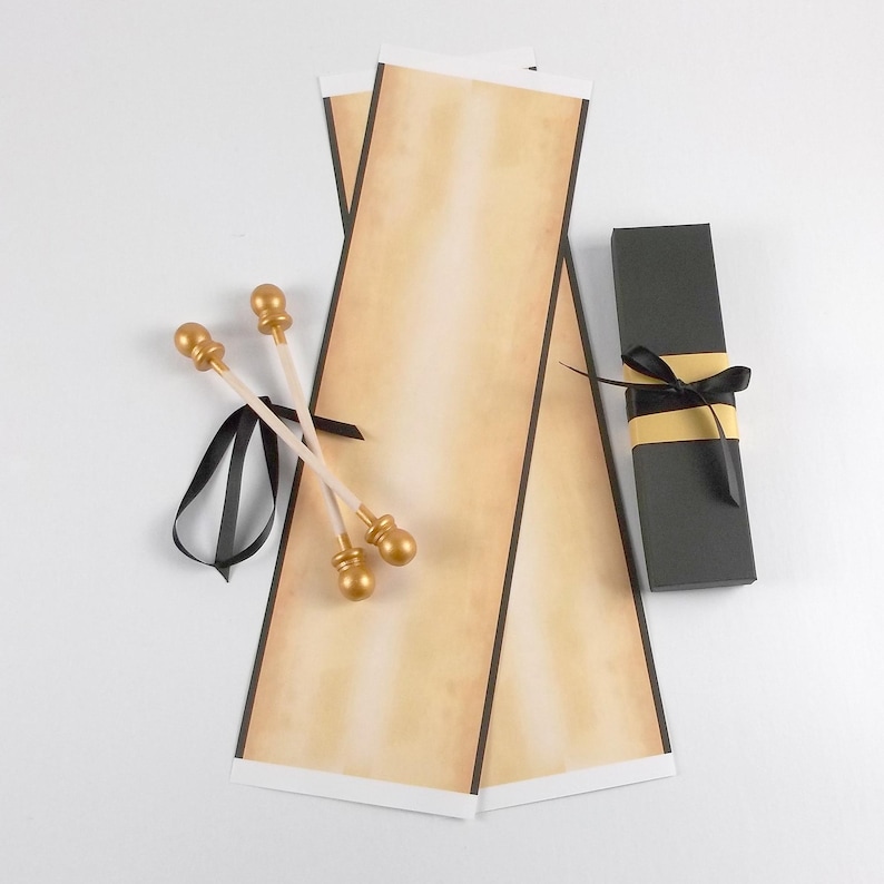 vintage style scroll kit with unassembled paper, gold finials, and black ribbon. includes a black gift box with paper band and ribbon.