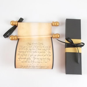 vintage style paper scroll with text, gold finials, and black ribbon. includes a black gift box with paper band and ribbon.