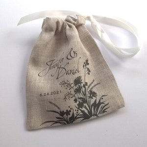 Rustic linen wedding ring pouch custom printed with bride and groom names and wedding date, wildflower silhouette