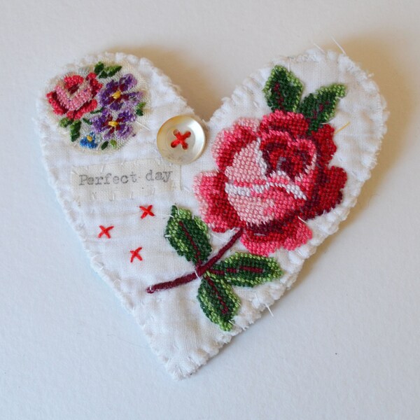 BROOCH Textile heart shaped.  Appliquéd rose trims. Hand stitched.