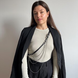 Leather harness belt with chain and heart charm, black lingerie-inspired body accessory