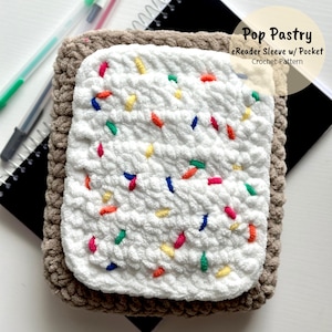 May include: A crocheted eReader sleeve with a pocket, shaped like a Pop-Tart with colorful sprinkles. The sleeve is made with brown and white yarn.