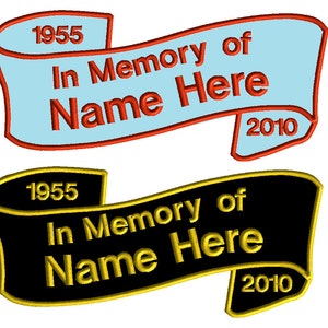 May include: Two embroidered ribbon banners with the text "In Memory of Name Here" and the years 1955 and 2010. The top banner is light blue with red stitching and the bottom banner is black with gold stitching.