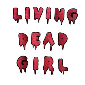 May include: Red dripping letters spelling out "LIVING DEAD GIRL" on a white background.