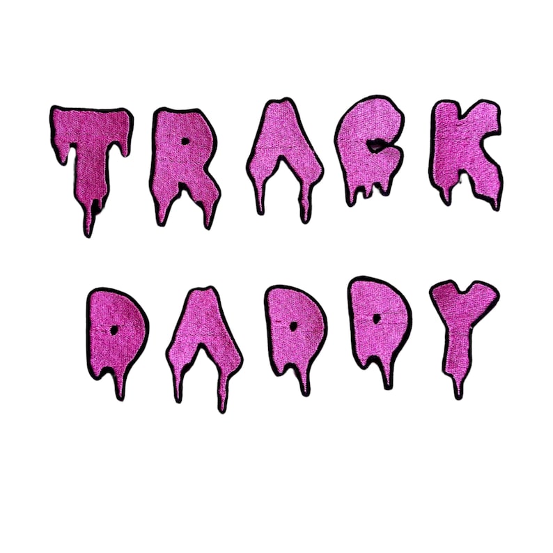 May include: Pink dripping letters spelling "TRACK DADDY" on a white background.