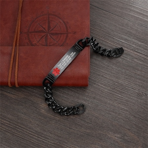 May include: Black medical alert bracelet with a silver chain. The bracelet has a red medical symbol and the text "Type 2 Diabetes, ICD 10: E11.9, ICD 9: 250.00, 78800"