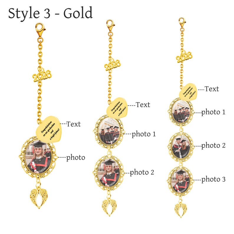 May include: Gold-colored graduation photo charms. Each charm features a chain with a 2026 charm, a heart-shaped tag with text, and an oval frame holding a photo. The charms have an angel wing pendant.