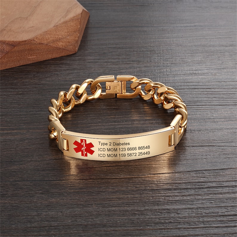 May include: Gold chain bracelet with a medical alert tag that reads "Type 2 Diabetes, ICD MOM 123 6666 86548, ICD MOM 159 5872 25449". The tag has a red medical symbol.