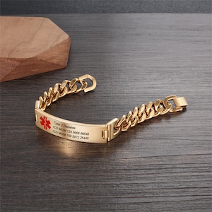 May include: Gold medical alert bracelet with a red medical symbol and the text "Type 2 Diabetes, ICD MOM 123 6666 86548, ICD MOM 159 5872 25449".