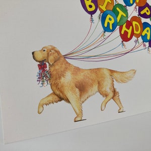 May include: A golden retriever dog runs with a string of colorful balloons that spell out "Happy Birthday".