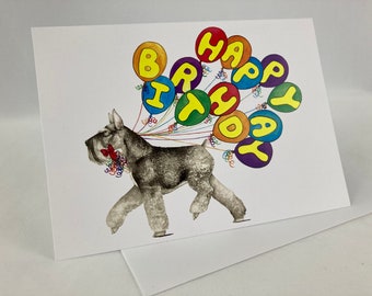 May include: A gray schnauzer dog wearing a red bow is walking with a string of colorful balloons that spell out "Happy Birthday".