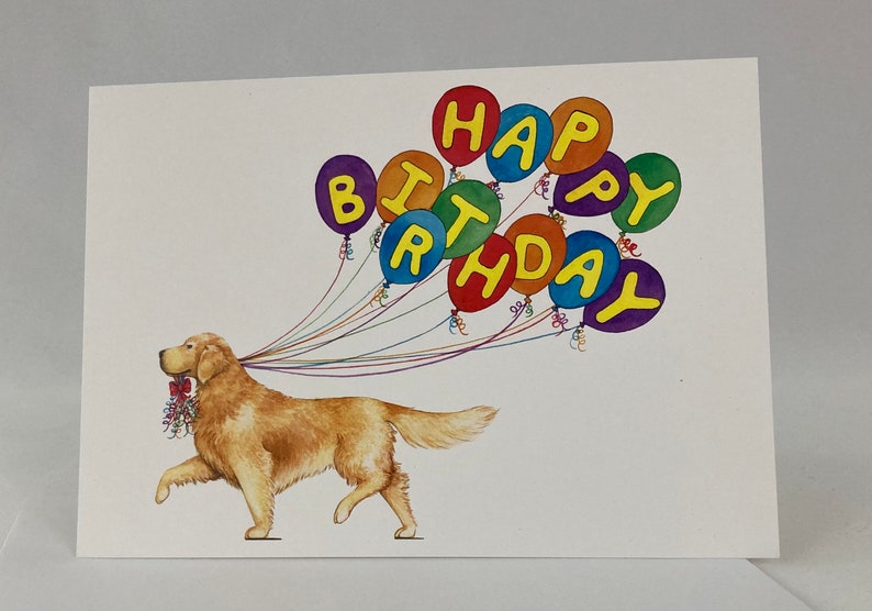 May include: A golden retriever dog is walking with a string of colorful balloons that spell out "Happy Birthday".
