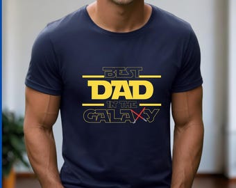 Best Dad In The Galaxy Shirt, Star Hero Gift For Dad Shirt, Funny Galaxy Dad Shirt, Lightsaber Star Gift Tee, Father’s Day Space Dad T-Shirt