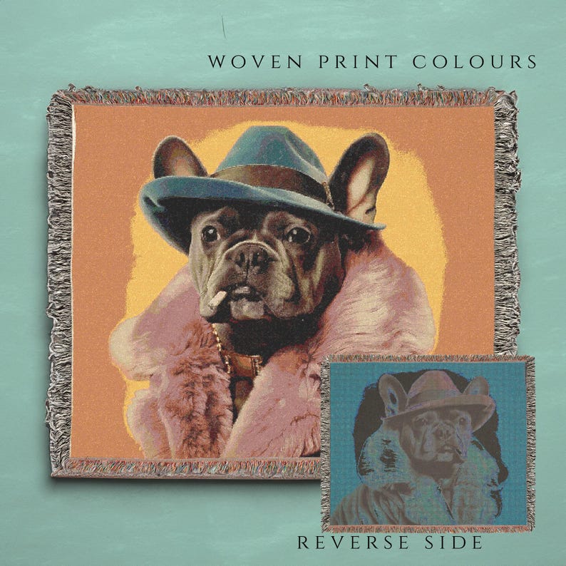 May include: A woven tapestry featuring a French Bulldog wearing a blue hat and a pink fur coat. The tapestry has a light orange background and the text "WOVEN PRINT COLOURS" at the top. The reverse side of the tapestry is shown in a smaller image below, with a blue background.