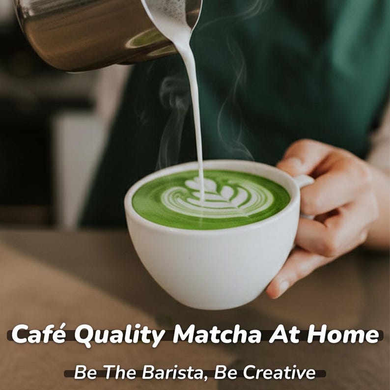 May include: A white ceramic cup filled with vibrant green matcha latte, with milk being poured to create a design. The text "Caf&eacute; Quality Matcha At Home" and "Be The Barista, Be Creative" are displayed at the bottom of the image.