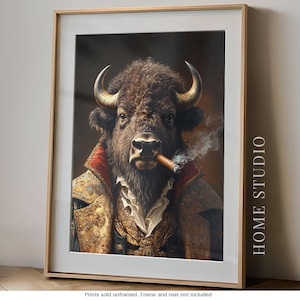May include: A framed wall art print featuring a portrait of a bison with horns, wearing an ornate gold and red jacket with a white ruffled shirt, smoking a cigar with visible smoke, with the text HOME STUDIO printed vertically on the right side.