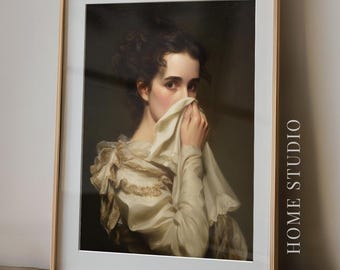 May include: A framed art print featuring a portrait of a person with dark hair wearing a cream-coloured ruffled blouse, holding a white cloth to their face. The text HOME STUDIO is printed vertically on the right side of the white matting.