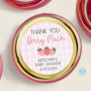 May include: Thank you berry much! Pink and white gingham favor jar with a strawberry design and the text "Katelynn's Baby Shower 6.19.20XX".