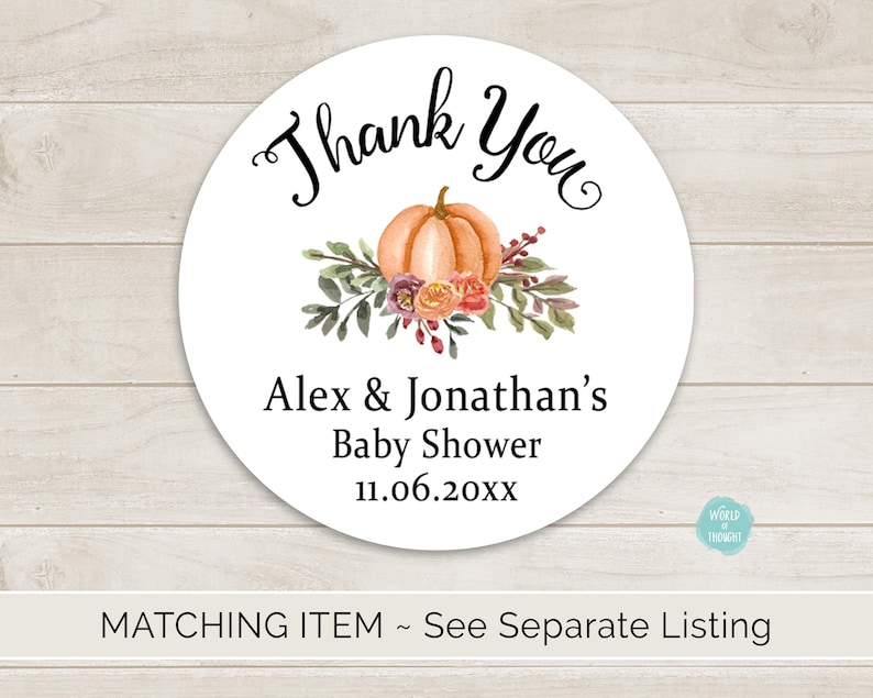 May include: Thank You sticker with a fall theme. The sticker features a pumpkin with floral accents and the text "Thank You", "Alex & Jonathan's", "Baby Shower", and "11.06.20xx".