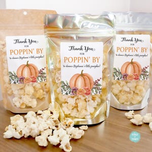 May include: Three clear plastic bags filled with popcorn and decorated with orange and brown pumpkin themed labels that say "Thank You for Poppin' By to shower Stephanie's little pumpkin!"
