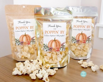 May include: Three clear plastic bags filled with popcorn and decorated with orange and brown pumpkin themed labels that say "Thank You for Poppin' By to shower Stephanie's little pumpkin!"
