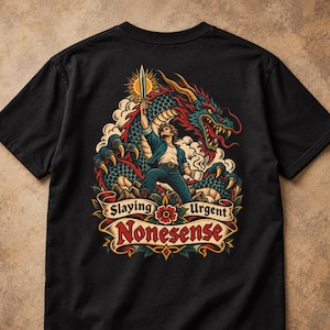 May include: A black t-shirt featuring a graphic illustration of a person holding a sword and a coffee mug in front of a large dragon. Below the figure, a banner displays the text Slaying Urgent Nonsense in red and black lettering.