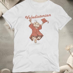 May include: A set of three ceramic mugs with a speckled, matte finish. The mugs are in shades of cream, light brown, and dark brown. Each mug has a simple, minimalist design, perfect for coffee or tea.