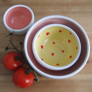 Medium pink and yellow pottery nesting bowls with hearts, Stacking ceramic prep bowls