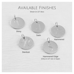 May include: Five silver discs with different finishes: shiny, satin, hammered, stardust, and hammered edge. The discs are 1.27 cm in diameter and show the letter "T", "J", "A", "R", and "S" engraved on them. The hammered edge finish is only available on discs 1.27 cm or larger.