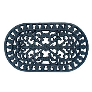 May include: Black oval doormat with an ornate, openwork design. The mat features a repeating floral and scroll pattern, with a border of small, stylized leaf shapes. The mat is made of a durable material and is suitable for outdoor use.