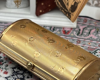 Polvos compactos vintage Kigu con forma de barril, tono dorado y diseño floral, convertibles, 7,5 cm.