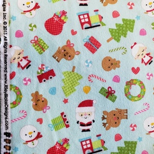 May include: A light blue fabric with a repeating pattern of Christmas-themed illustrations. The pattern includes Santa Claus, reindeer, presents, candy canes, snowmen, and Christmas trees. The illustrations are in red, green, white, and brown.