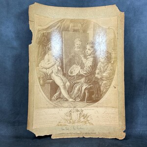 May include: A vintage black and white print of a painting depicting three people. A woman is painting a nude model while a young boy observes. The print is framed with a decorative border and includes the text "La Lecture de la Nature" and "L. Garnier Editeur, Paris".