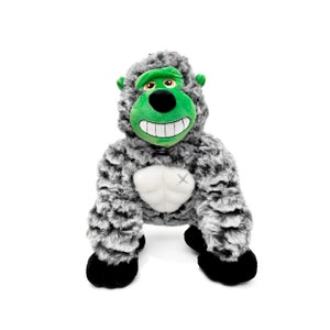 May include: A plush gray gorilla toy with a green face and a big smile. The gorilla has black eyes and a white chest with a black X.