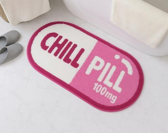 Alfombra de baño Chill Pill: Alfombra de baño rosa con mechones