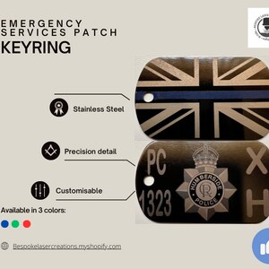 May include: A black metal keychain featuring a Union Jack flag design with a blue stripe across the middle. The keychain also displays the text "PC 1323 X H" and a police badge with the inscription "Humberside Police".